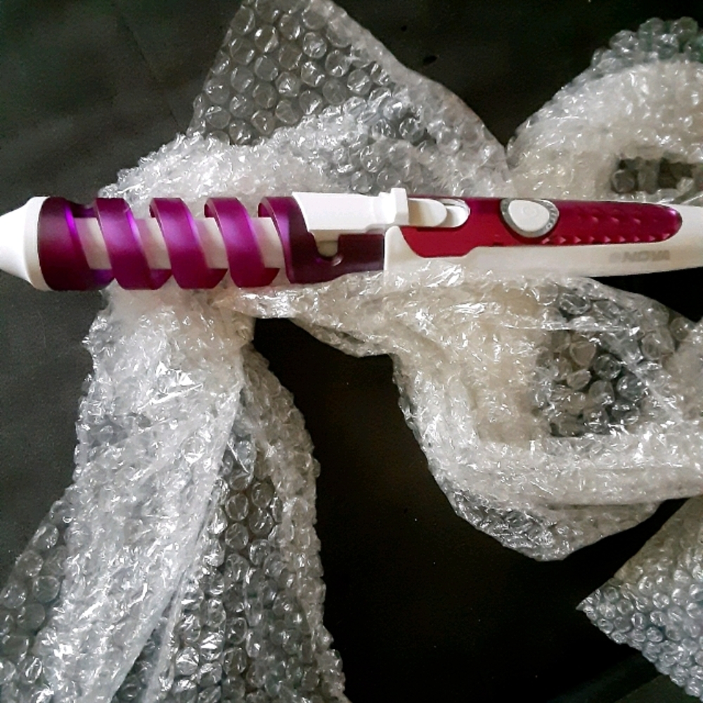 Nova curling iron brand new in bubble wrap